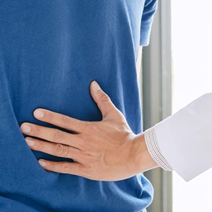 Physiotherapist in Gurgaon helping patient with lower back pain relief exercises.